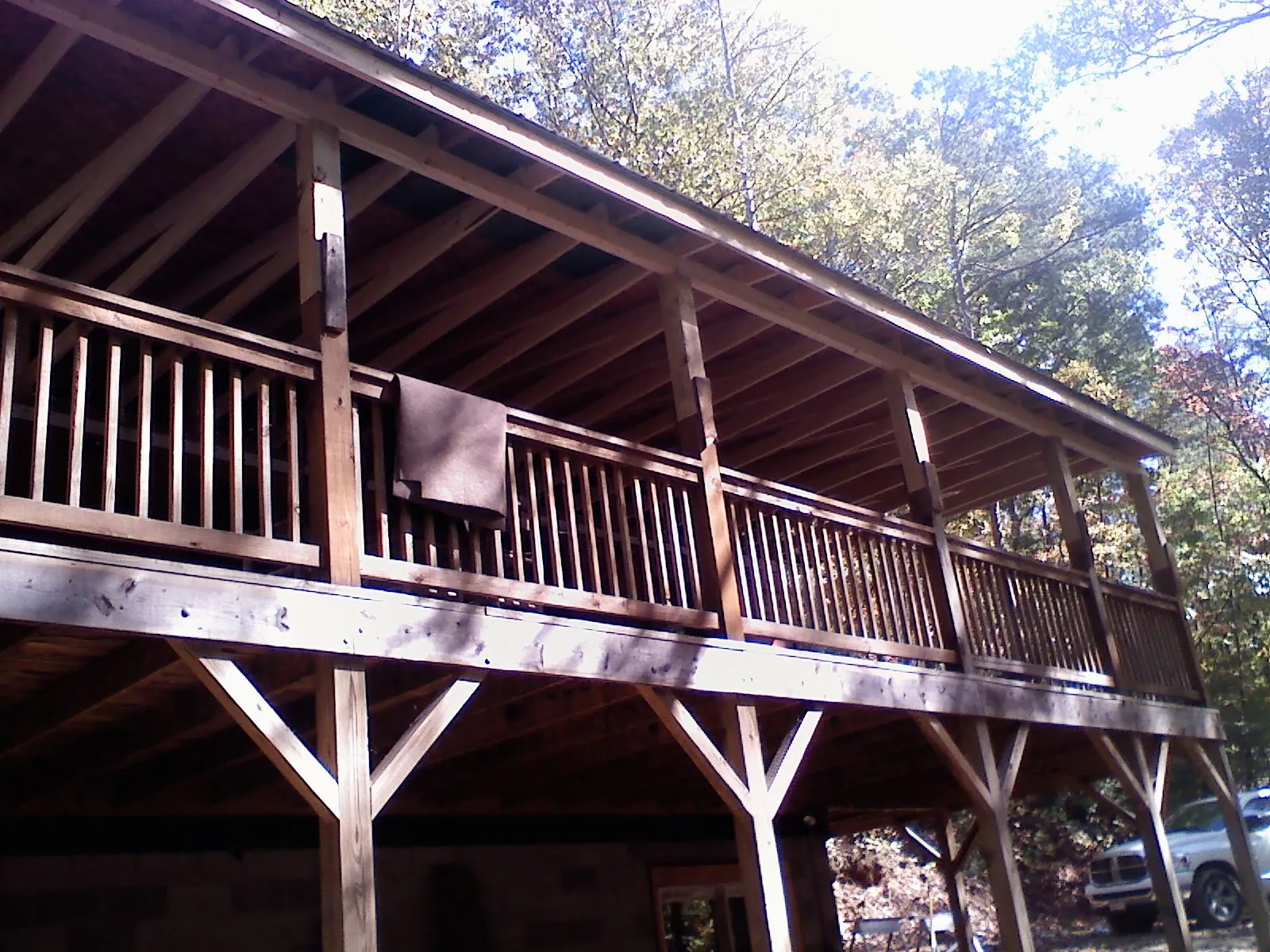 Timber framing under a new elevated porch and deck — Roof Leak Repair in Ouaquaga by Roofing Brothers